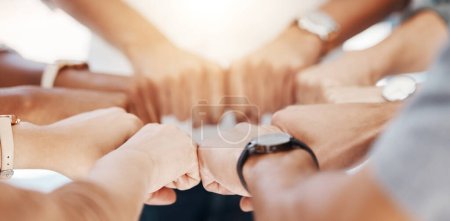Photo for Group, circle and fist bump with team building closeup, community or collaboration for goals in office. Business people, synergy and productivity with solidarity, agreement or networking in workplace. - Royalty Free Image