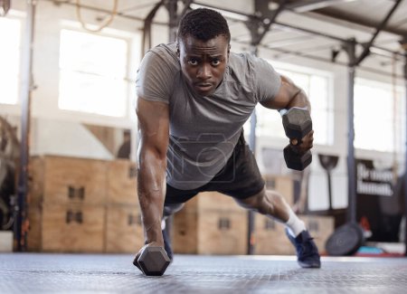 Photo for Dumbbells, push up and exercise with a black man at gym for fitness, training workout and strong muscle. Serious African athlete or bodybuilder person with weights for power, focus and performance. - Royalty Free Image