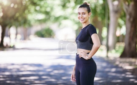 Photo for Portrait, runner or happy woman ready for fitness workout or body movement while relaxing on break. Resting, tired sports athlete or healthy girl in exercise training with smile or confidence in park. - Royalty Free Image