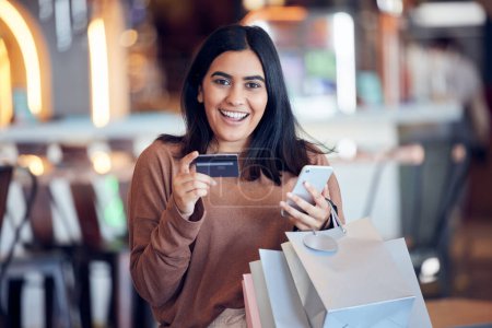 Photo for Portrait, bags and woman with credit card, smartphone and shopping with boutique clothes, retail and shopping. Face, female person and customer in a store, smile and cellphone with payment and sales. - Royalty Free Image