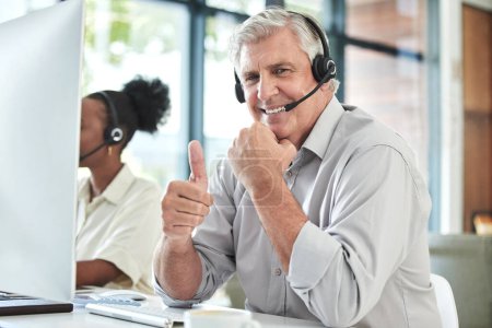 Photo for Thumbs up, customer support and portrait of senior man for online help, thank you and telemarketing. Call center, hand sign and happy elderly male worker for contact us, crm service and consulting. - Royalty Free Image