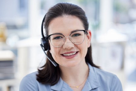 Photo for Consultant, portrait of woman call center agent and with headset at her workplace office with smile. Customer service or telemarketing, support or online communication and female person for crm. - Royalty Free Image