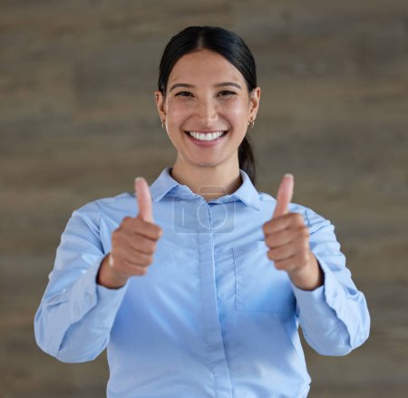 Photo for Portrait, business woman and thumbs up for success isolated on wood background for support, like or okay sign. Happy face of person in Mexico or winner with yes, winning and agreement hands or emoji. - Royalty Free Image