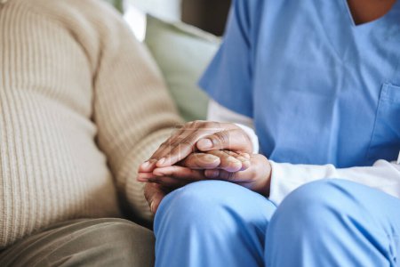 Photo for Man, nurse and holding hands for support, healthcare and kindness at nursing home. Patient, caregiver service and closeup woman together for trust, homecare and help or hope for empathy in retirement. - Royalty Free Image