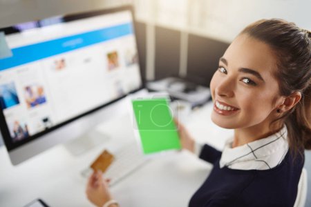 Photo for Welcome to my job life. Portrait of an attractive young businesswoman holding a bank card and a tablet in a modern office - Royalty Free Image