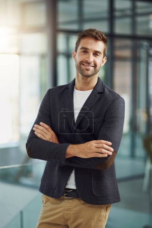 Photo for The longer youre in business, the better you do. Portrait shot of a handsome businessman standing with his arms crossed - Royalty Free Image