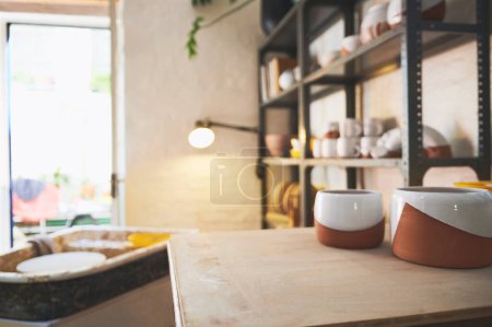 Photo for Straight from our shelves to your home. various vases and pots on a shelf in a pottery studio - Royalty Free Image