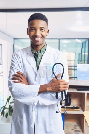 Photo for Im a doctor you can rely on. Cropped portrait of a handsome young male doctor standing with his arms folded in the hospital - Royalty Free Image