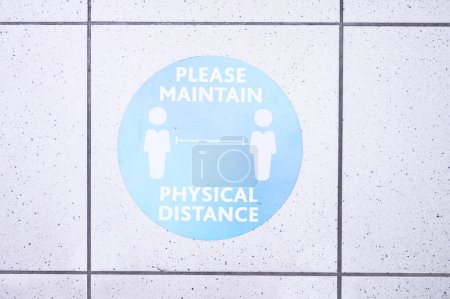 Photo for Lets follow the rules please. a social distancing sign at the airport - Royalty Free Image