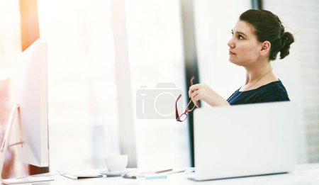 Photo for Shes still got many more dreams to pursue. a thoughtful young businesswoman working at her desk in an office - Royalty Free Image