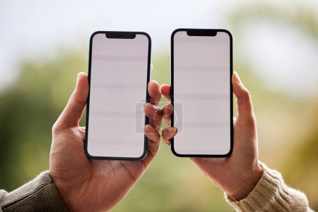 Photo for Phone screen, mockup and hands of couple of friends with online promotion and deal space outdoor. Hand, mobile and advertisement on cellphone with connectivity, network and dating app on web. - Royalty Free Image