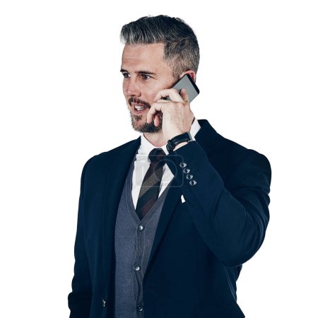 Photo for Everyones dialing his number. Studio shot of a businessman using a mobile phone against a white background - Royalty Free Image