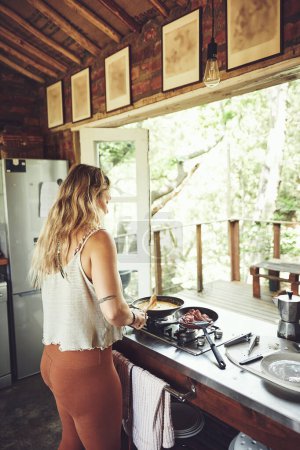 Photo for They only thing I need now is breakfast. a young woman preparing a meal - Royalty Free Image