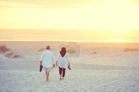 Photo for Vacation mode on. a mature couple going for a relaxing walk on the beach - Royalty Free Image