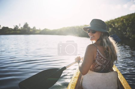 Photo for Its really beautiful out here. a young woman out kayaking on a lake - Royalty Free Image