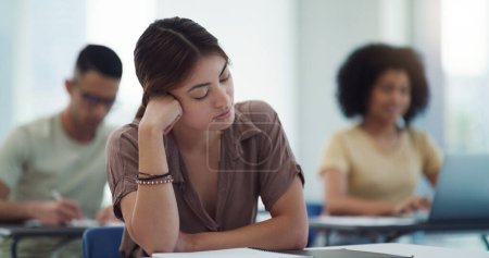 Photo for Sleeping, burnout and girl college student in a classroom bored, adhd or daydreaming during lecture. Tired, fatigue and female learner distracted in class, insomnia, boring or exam and quiz stress. - Royalty Free Image