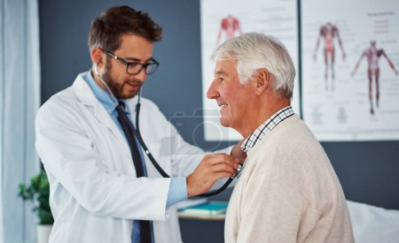 Photo for He knows hes in good hands with his doctor. a doctor examining a senior patient with a stethoscope in a clinic - Royalty Free Image