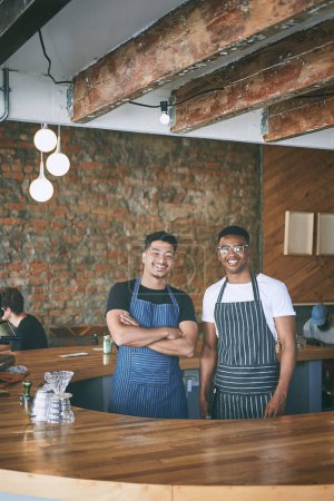 Photo for Once youve had our coffee, you wont want anyone elses. two confident young men working in a cafe - Royalty Free Image