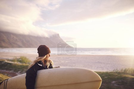 Photo for My heart belongs to the ocean. an attractive young woman out surfing in the wilderness - Royalty Free Image