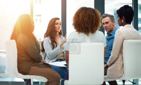 Photo for No update goes unshared. a team of colleagues having a meeting in a modern office - Royalty Free Image