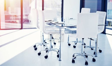 Photo for Workers should be able to take pride in their workplace. an empty boardroom furnished with a table and chairs - Royalty Free Image