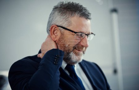 Photo for Wheres a massage therapist when you need one. a mature businessman experiencing neck ache at work in a modern office - Royalty Free Image