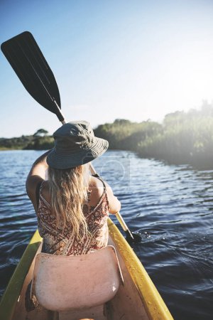 Photo for Time spent on the water is time well spent. a young woman out kayaking on a lake - Royalty Free Image