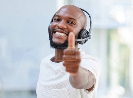 Photo for Call center, portrait and man thumbs up, success and thank you or like, yes and winning in office support or communication. Agent face, consultant or african person for thanks, okay or good job emoji. - Royalty Free Image