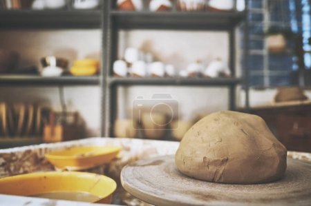 Photo for Ready, set, create. a lump of clay on a pottery wheel in a ceramic studio - Royalty Free Image