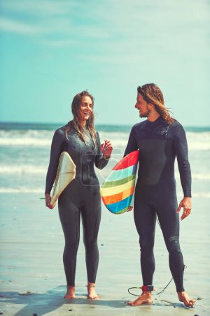 Photo for When youre surfing, youre living. a young couple surfing at the beach - Royalty Free Image