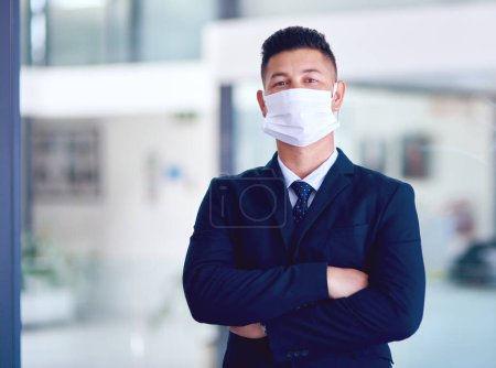 Photo for Business man, face mask and portrait with arms crossed for company work, attorney and motivation. Success, male employee and professional lawyer in law firm at office with job pride and virus safety. - Royalty Free Image