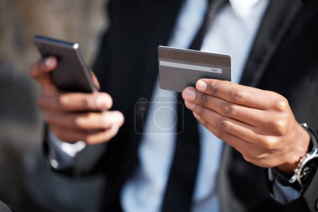 Photo for Hands, phone and a credit card for an online payment, shopping or ecommerce. Contact, finance and closeup of a businessman on a mobile app for banking, investing money and paying on the internet. - Royalty Free Image