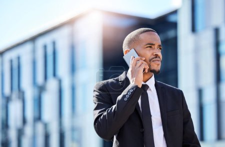 Photo for Black man, business phone call and listening in street with contact, chat and focus on career vision. Young african businessman, smartphone and talk for networking, sales or financial trading on road. - Royalty Free Image