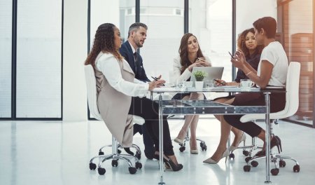 Photo for Collaborating to make business even better. a group of colleagues having a meeting in a modern office - Royalty Free Image