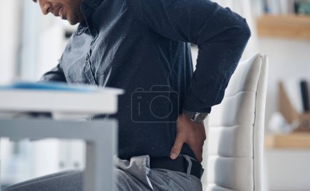 Photo for Tired, back pain and stress with business man in office for problem, frustrated and muscle fatigue. Burnout, tension and body with closeup of male employee for spine injury, accident and emergency. - Royalty Free Image