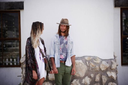 Photo for Hipster love. a trendy young couple standing together against the wall of a building outside - Royalty Free Image