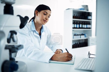 Photo for Woman, scientist and writing notes in science research for discovery, breakthrough or information at lab. Female person or medical expert with notebook for scientific data or results in laboratory. - Royalty Free Image