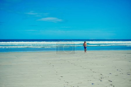 Photo for Tropical state of mind. a young man spending the day at the beach - Royalty Free Image