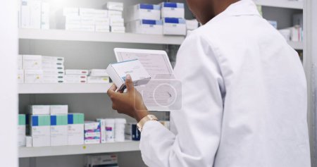 Photo for Filling is done digitally these days. an unrecognizable young pharmacist using a digital tablet to fill a prescription in a chemist - Royalty Free Image