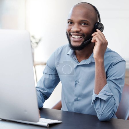 Photo for Black man, callcenter with phone call and computer, communication with headset and contact us in office. Male consultant in portrait, customer service and tech support with help desk worker and smile. - Royalty Free Image