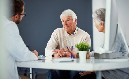 Photo for Please give us some good news, doctor. a senior couple having a consultation with a doctor in a clinic - Royalty Free Image