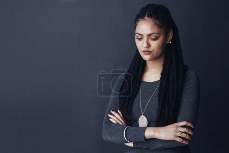 Photo for Im so tired of being disappointed. Studio shot of a young woman posing against a gray background - Royalty Free Image