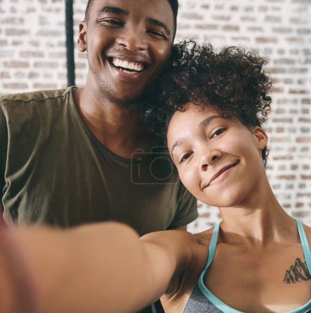 Photo for The post workout mood. two sporty young people taking a selfie at the gym - Royalty Free Image