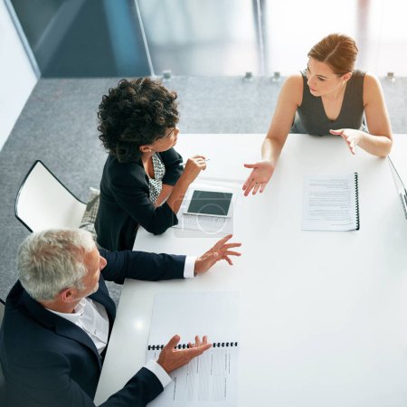 Photo for People in business meeting, collaboration and planning top view, project management and paperwork. Teamwork, man and women in strategy discussion with market research and mission in conference room. - Royalty Free Image