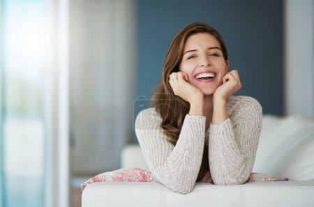 Photo for Portrait, happy and woman relax on sofa in home living room laughing at comedy. Face, smile or excited female person from Canada on couch in lounge, apartment or house to enjoy me time, joke or funny. - Royalty Free Image