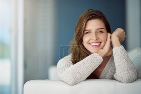 Photo for Portrait, happy and woman relax on sofa in home living room on holiday. Face, smile or young female person from Canada on couch in lounge, apartment or house to enjoy me time, vacation or break alone. - Royalty Free Image