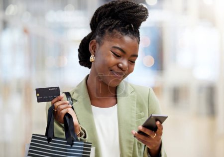Photo for Credit card, face and woman with phone for shopping, sales or smile of person at mall, fashion or shop at clothing store. Girl, discount and mobile payment for purchase, bags and happy customer. - Royalty Free Image