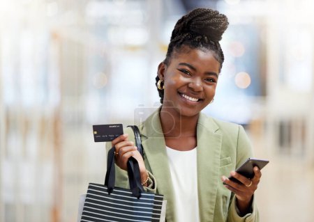 Photo for Woman, credit card and portrait of shopping, sales or smile of person at mall, fashion or shop discount at clothing store. Girl, phone and mobile payment for purchase, bags and happy customer. - Royalty Free Image