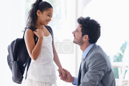Photo for Holding hands, education and father with girl in morning talking, in conversation and greeting bye for school. Family, home and happy dad speaking to young girl ready for learning, class and lesson. - Royalty Free Image