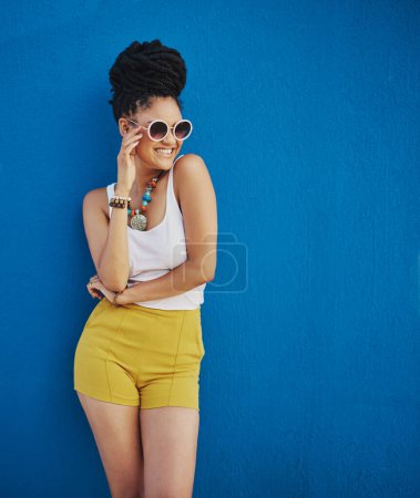 Photo for Sunglasses, fashion and portrait of woman on blue background, wall and summer streetwear, trendy clothes or shades mockup. Girl, happy and excited model with cool style, vision and urban mock up. - Royalty Free Image